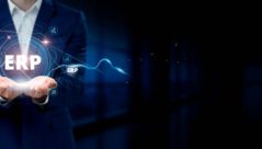 Businessman Holding Virtual Enterprise Resource Planning (ERP) Network Connection Icons. Streamlining Processes, Integration, Efficiency in Internet Business and Social Network.